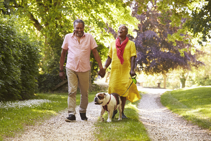 Older couple dog walking